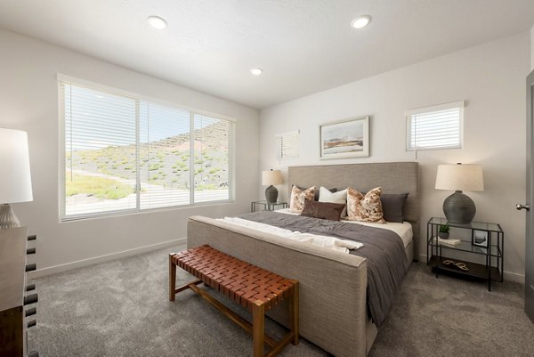 Cozy bedroom with modern furnishings at Black Ridge Cove Apartments