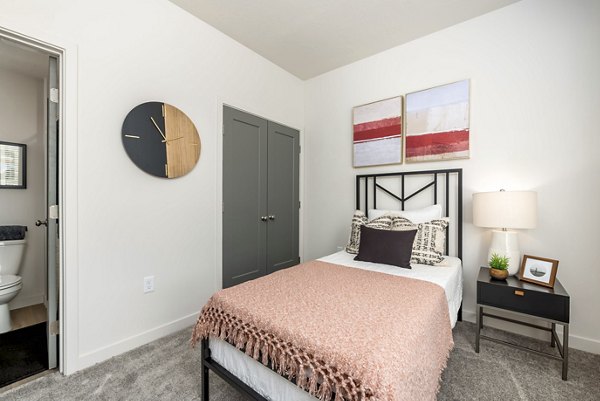Cozy bedroom with modern furnishings at Black Ridge Cove Apartments