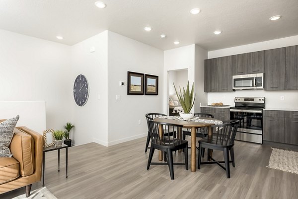 Dining area featuring modern furnishings and natural light in Black Ridge Cove Apartments