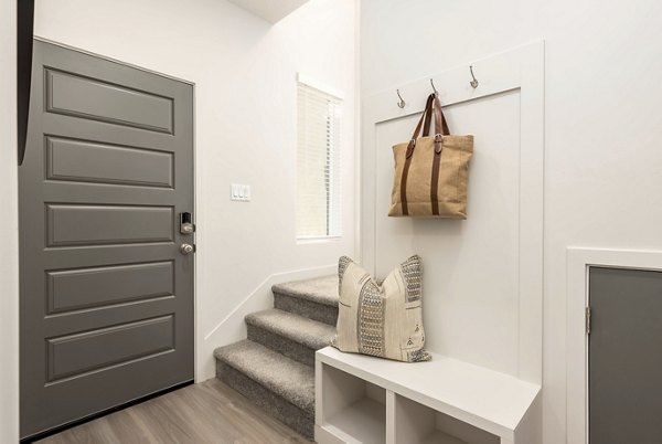 Elegant hallway featuring modern lighting fixtures at Black Ridge Cove Apartments