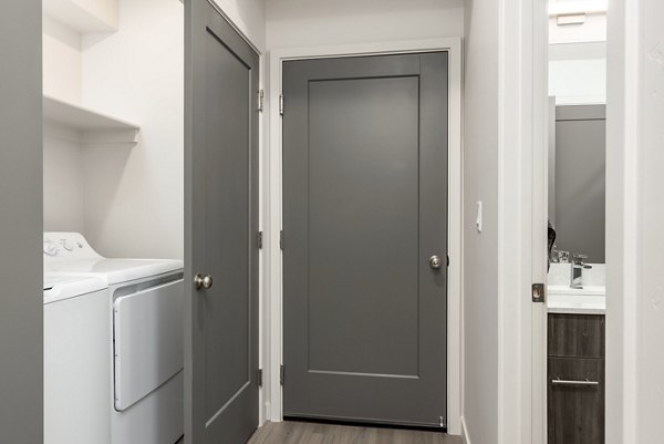 Hallway featuring modern lighting and hardwood floors at Black Ridge Cove Apartments