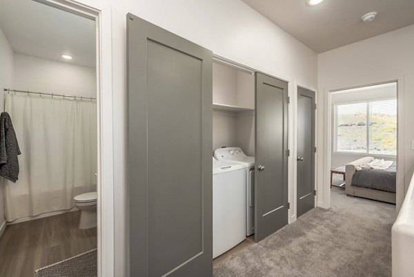 Modern laundry room with high-efficiency machines at Black Ridge Cove Apartments