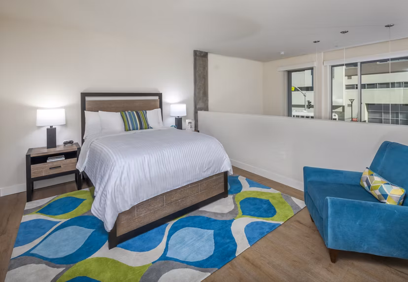 Elegant bedroom with modern design at mResidences Olympic & Olive Apartments in Seattle