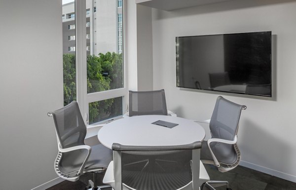 Modern meeting facility at mResidences Olympic & Olive Apartments with stylish design and advanced technology