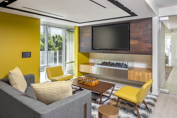mResidences Olympic & Olive: Elegant clubhouse with modern seating and ambient lighting for relaxation and social gatherings