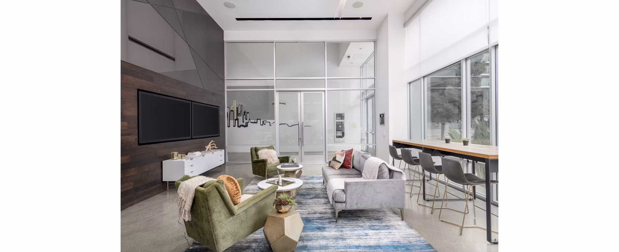 Clubhouse featuring stylish seating and modern decor at mResidences Olympic & Olive Apartments