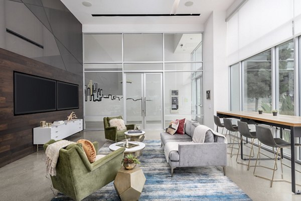 Clubhouse featuring stylish seating and modern decor at mResidences Olympic & Olive Apartments