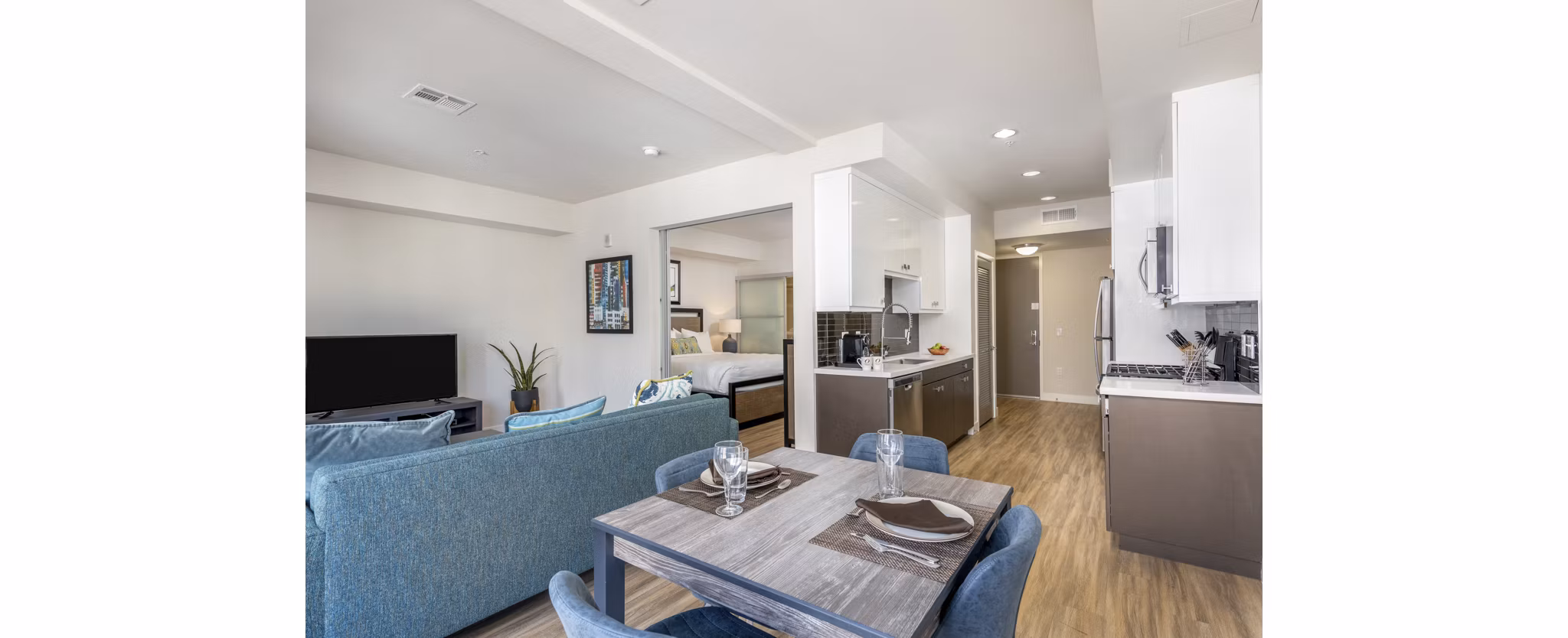 Dining area with modern decor and natural lighting at mResidences Olympic & Olive Apartments