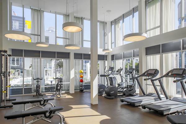 fitness center at mResidences Olympic & Olive Apartments