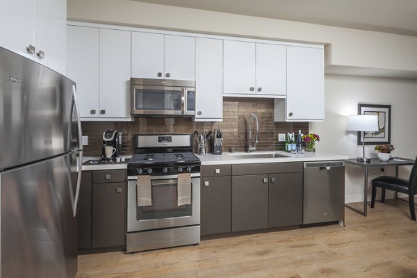 kitchen with modern appliances at mResidences Olympic & Olive luxury apartments