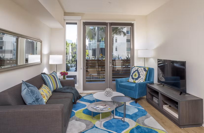 Contemporary living room with stylish furnishings in mResidences Olympic & Olive Apartments