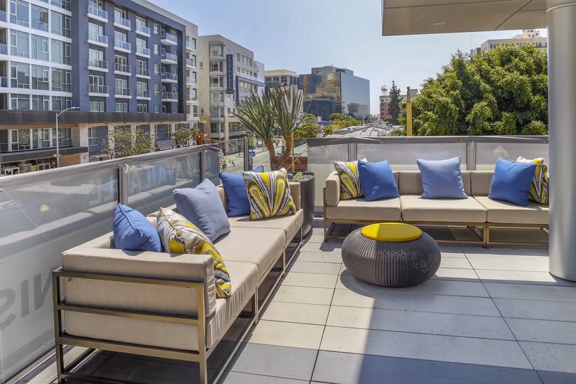 Rooftop deck at mResidences: Stylish outdoor seating and city views at Olympic & Olive Apartments