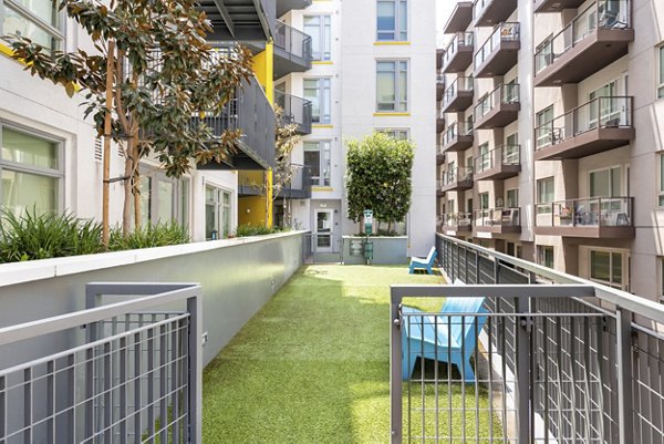 Dog park with agility equipment at mResidences Olympic & Olive Apartments