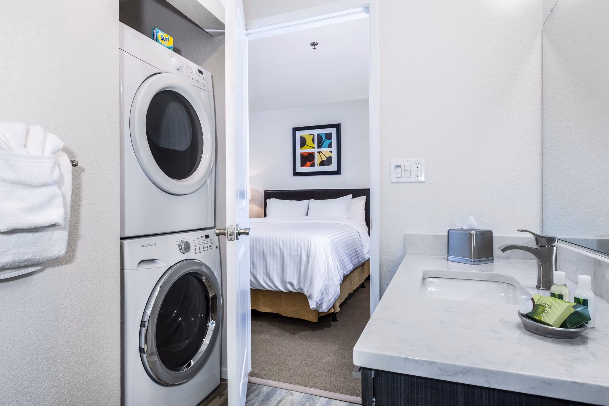 Bath and laundry room with modern fixtures at mResidences Silicon Valley Apartments