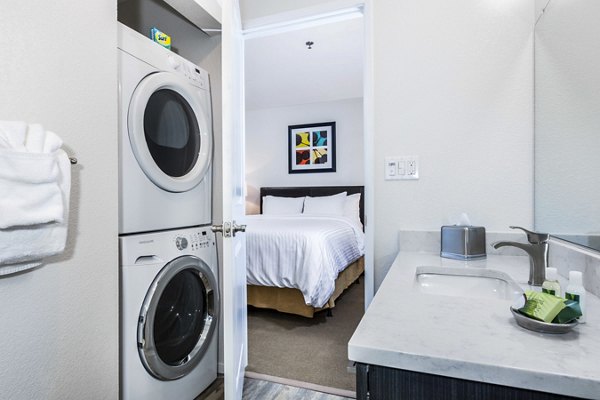 bath and laundry room at mResidences Silicon Valley Apartments