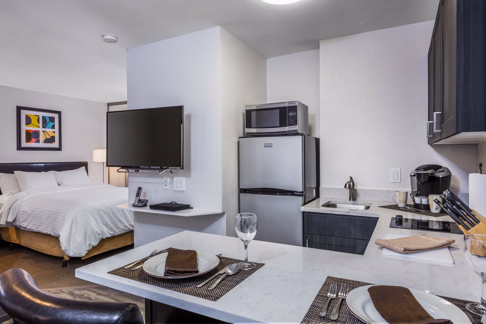 Modern kitchen with stainless steel appliances in mResidences Silicon Valley Apartments