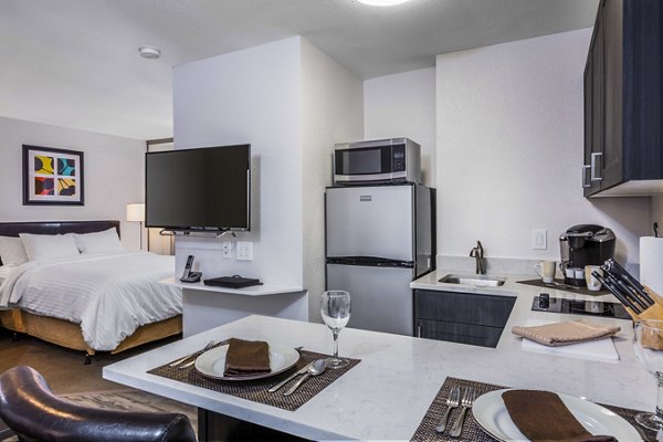 Modern kitchen with stainless steel appliances in mResidences Silicon Valley Apartments