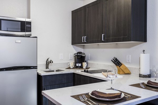 Modern kitchen with stainless steel appliances at mResidences Silicon Valley Apartments