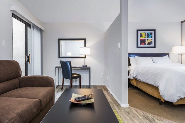 Spacious living room with modern dÃ©cor at mResidences Silicon Valley Apartments