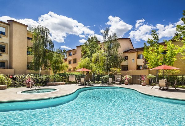 Sparkling pool at mResidences Silicon Valley Apartments, ideal for relaxation and social gatherings in a luxury setting