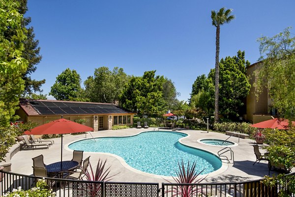 Resort-style pool with lounge chairs at mResidences Silicon Valley Apartments