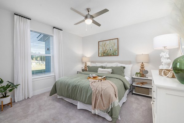 Bedroom with modern decor and ample natural light at Wentworth Park Apartments