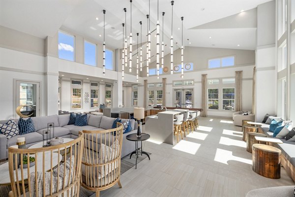 Elegant clubhouse featuring modern seating and lighting at Wentworth Park Apartments