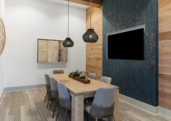 Meeting facility with modern seating and AV equipment at Wentworth Park Apartments, ideal for conferences and corporate events