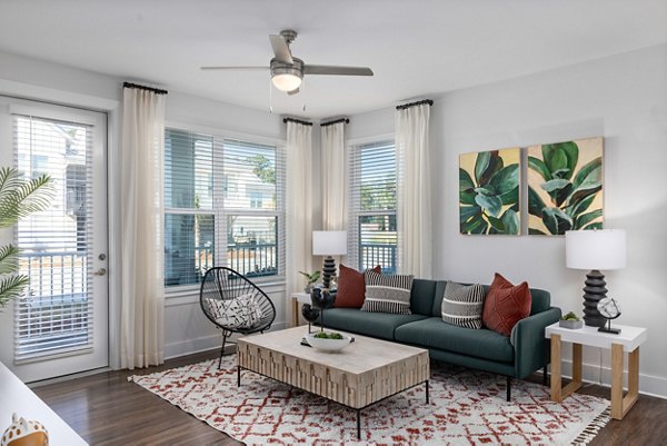Living room featuring modern decor and natural light in Wentworth Park Apartments