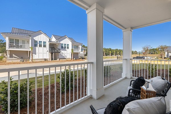 Chic patio area with modern furniture at Wentworth Park Apartments