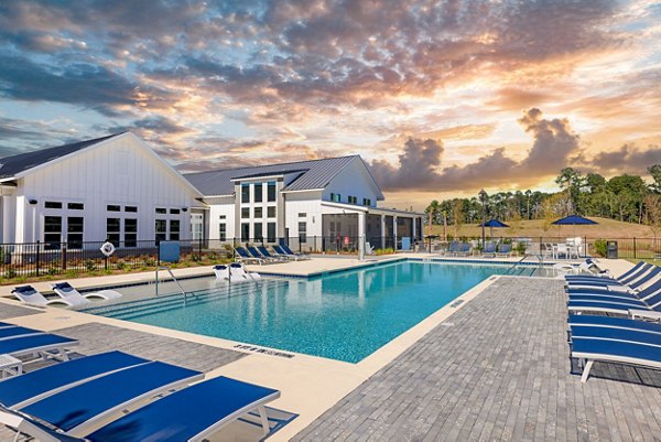 Sunlit outdoor pool at Wentworth Park Apartments, offering luxury relaxation and leisure facilities