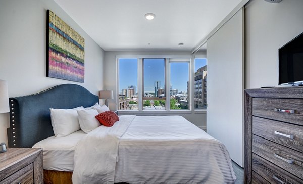 Bedroom featuring modern decor and ample space at mResidences Portland Pearl District Apartments