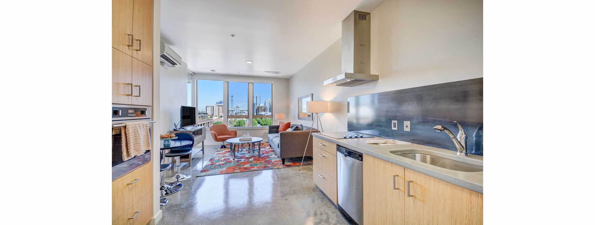 Kitchens featuring modern appliances and sleek design at mResidences Portland Pearl District Apartments