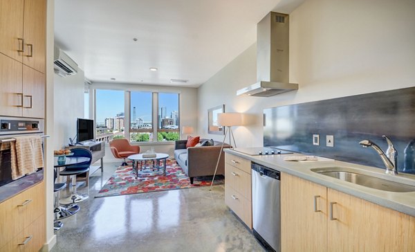 Kitchens featuring modern appliances and sleek design at mResidences Portland Pearl District Apartments