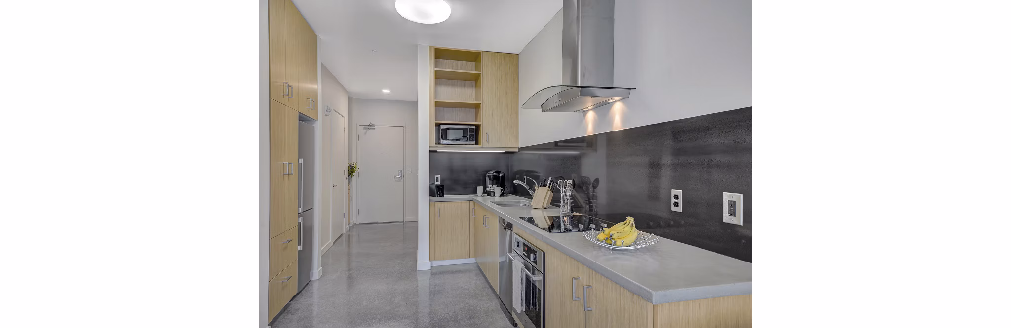 Spacious kitchen with modern appliances at mResidences Portland Pearl District Apartments