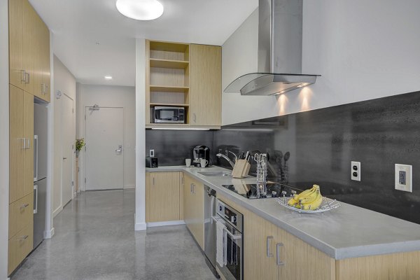 Spacious kitchen with modern appliances at mResidences Portland Pearl District Apartments