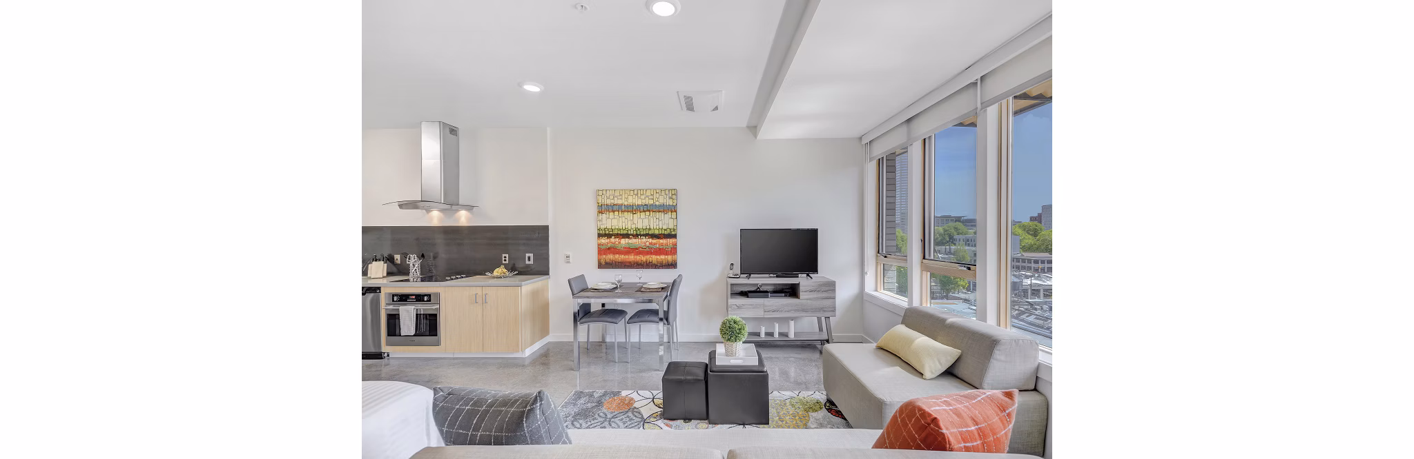 Spacious living room with modern decor in mResidences Portland Pearl District Apartments