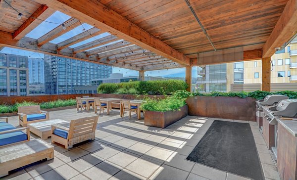 Outdoor grilling area with modern furniture in mResidences Portland Pearl District Apartments