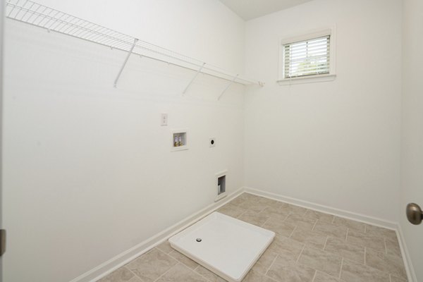 laundry room at Drexler Townhomes at Holbrook FarmsBaxter Woods Apartments