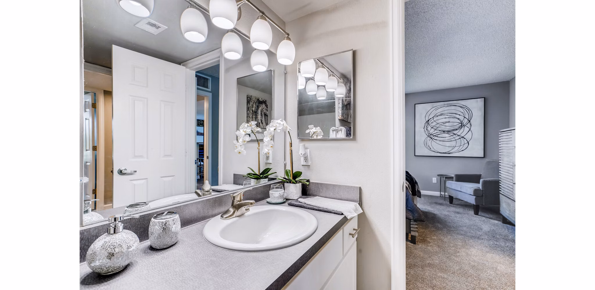 Bathroom with modern fixtures and sleek design at Loretto Heights Apartments, a Greystar luxury property in Denver