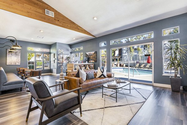 Loretto Heights Apartments: Stylish clubhouse with comfortable seating and modern design