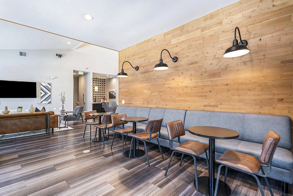 Modern clubhouse with elegant furnishings at Loretto Heights Apartments, perfect for social gatherings and community events