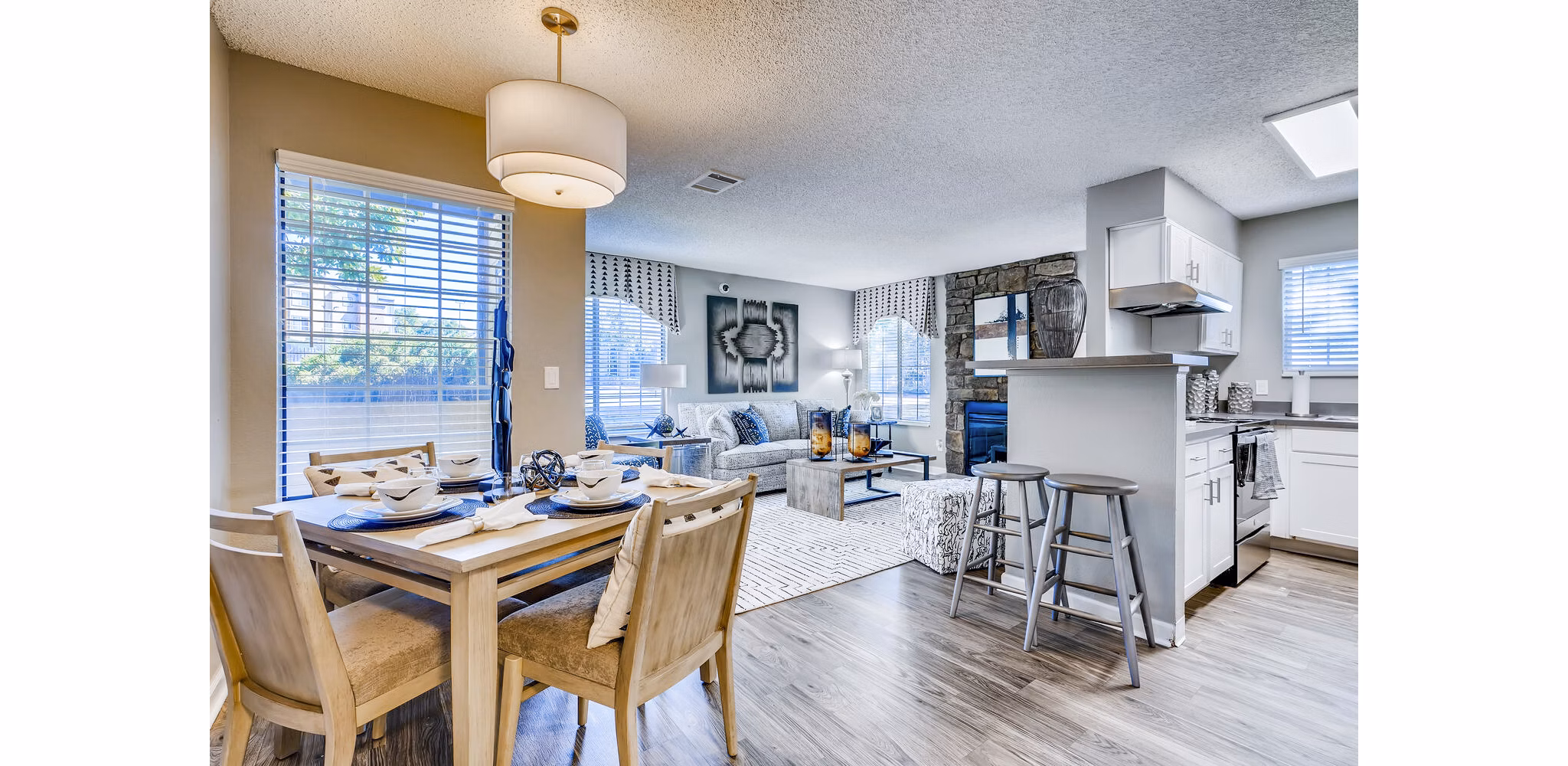 Modern dining room with elegant lighting at Loretto Heights Apartments offering luxury living spaces