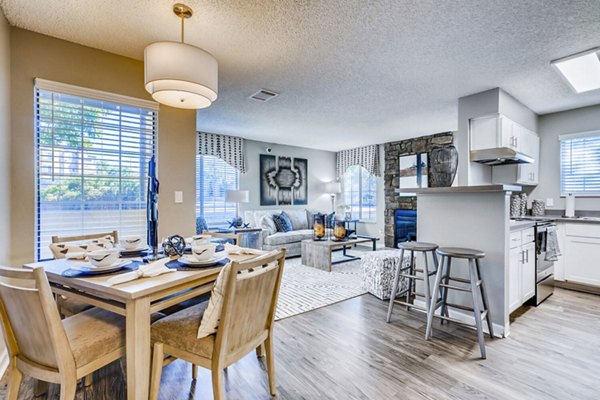 Modern dining room with elegant lighting at Loretto Heights Apartments offering luxury living spaces