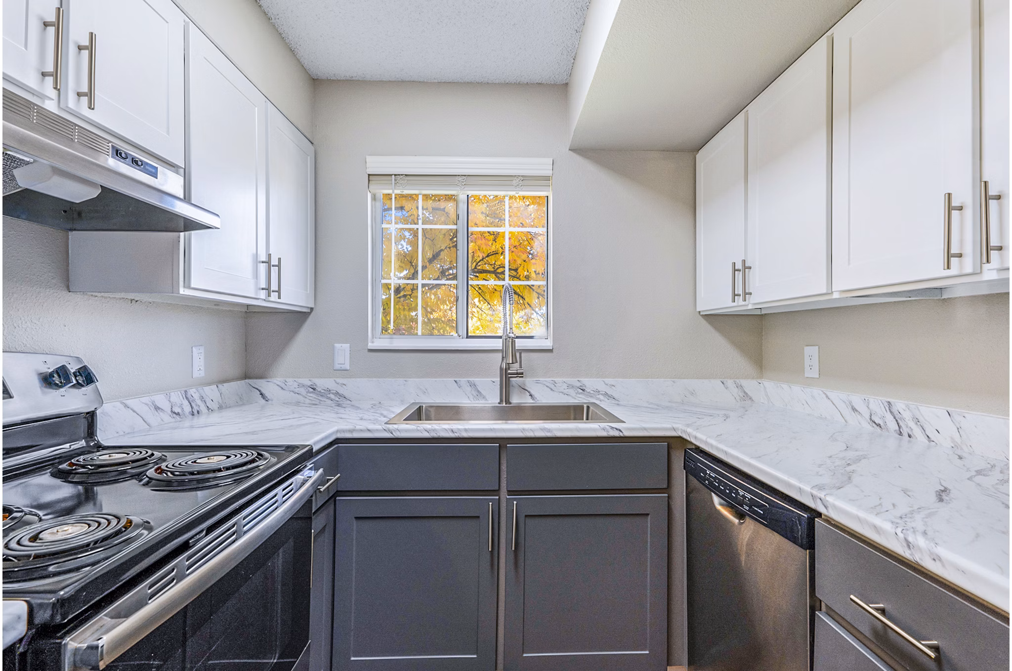 Modern kitchen with stainless steel appliances at Loretto Heights Apartments