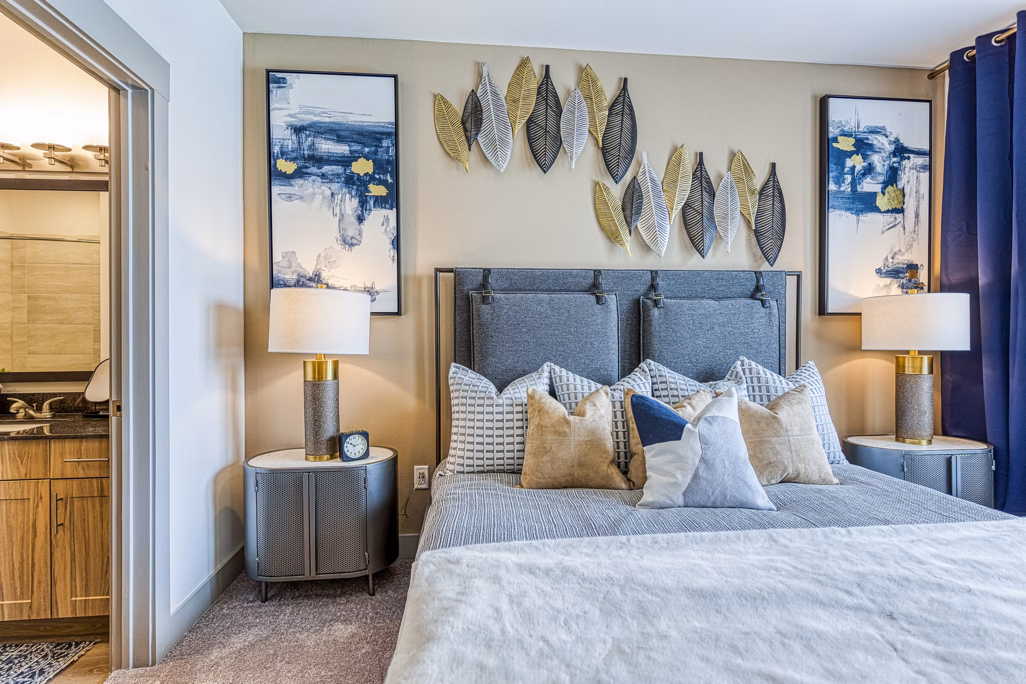 Cozy bedroom with modern decor at The Banks of Springdale Apartments, luxury living with premium amenities