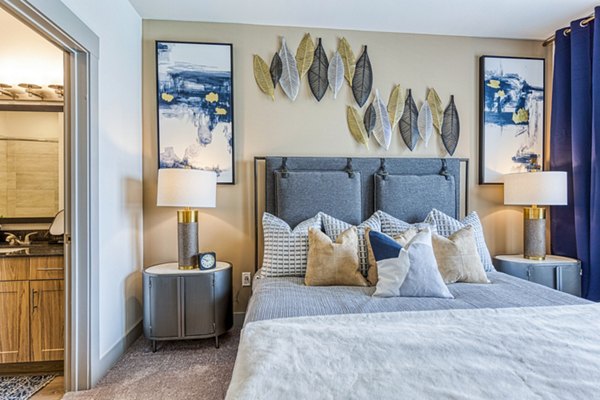 Cozy bedroom with modern decor at The Banks of Springdale Apartments, luxury living with premium amenities