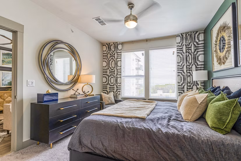 Cozy bedroom with stylish decor at The Banks of Springdale Apartments
