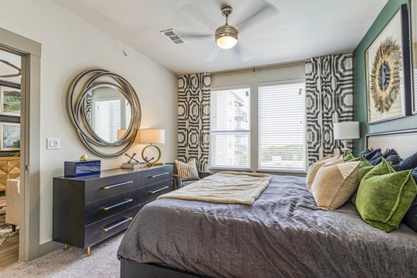 Cozy bedroom with stylish decor at The Banks of Springdale Apartments