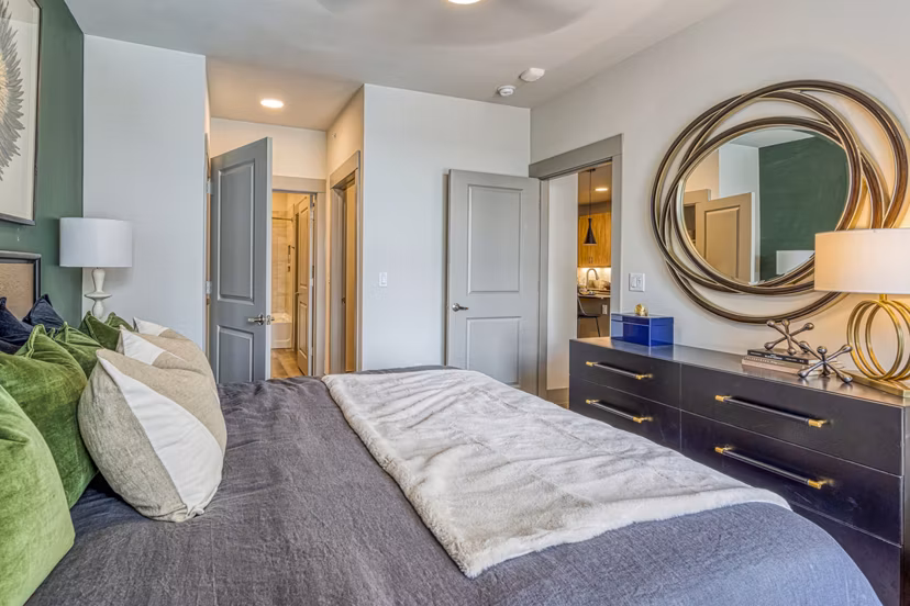 Cozy bedroom with modern decor at The Banks of Springdale Apartments